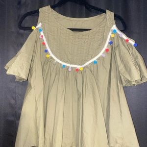 blouse with pom poms